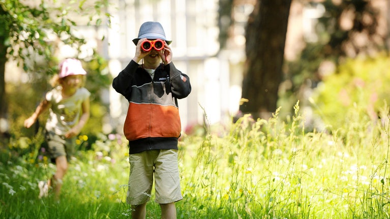 Children exploring the garden at Rufford Old Hall, Lancashire